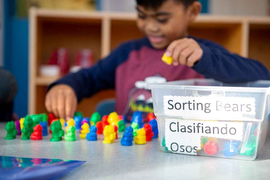 boy playing with sorting cubes