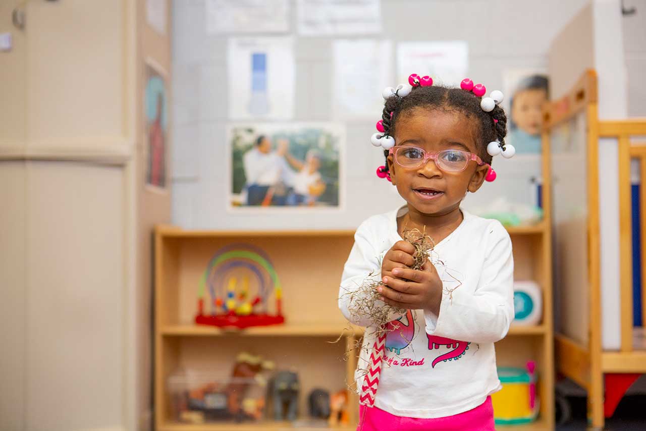 little toddler girl looking at camera